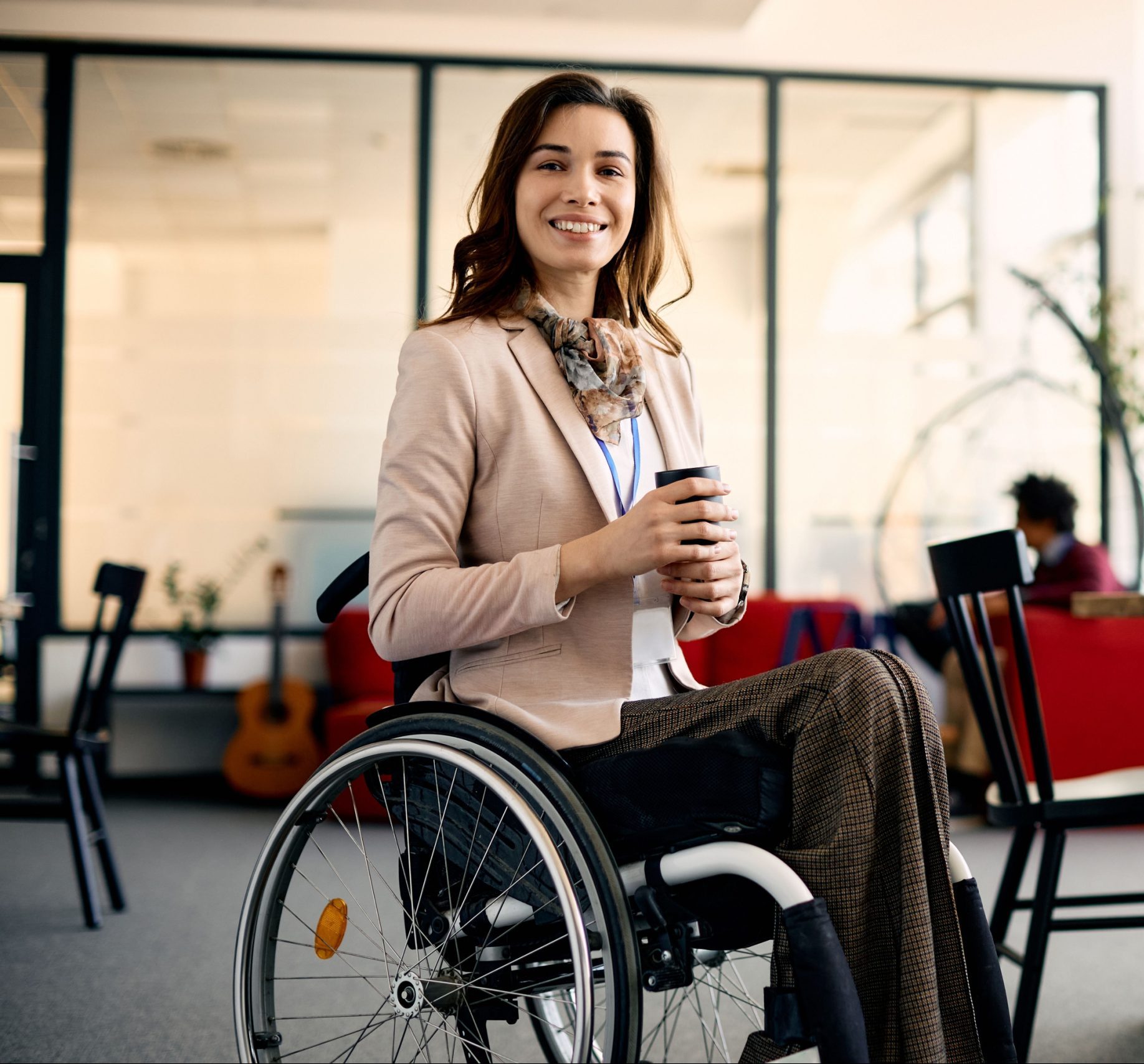 Woman in wheelchair with guide dog.